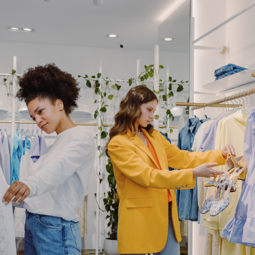 2 girls in shopping mall looking for pastel outfit